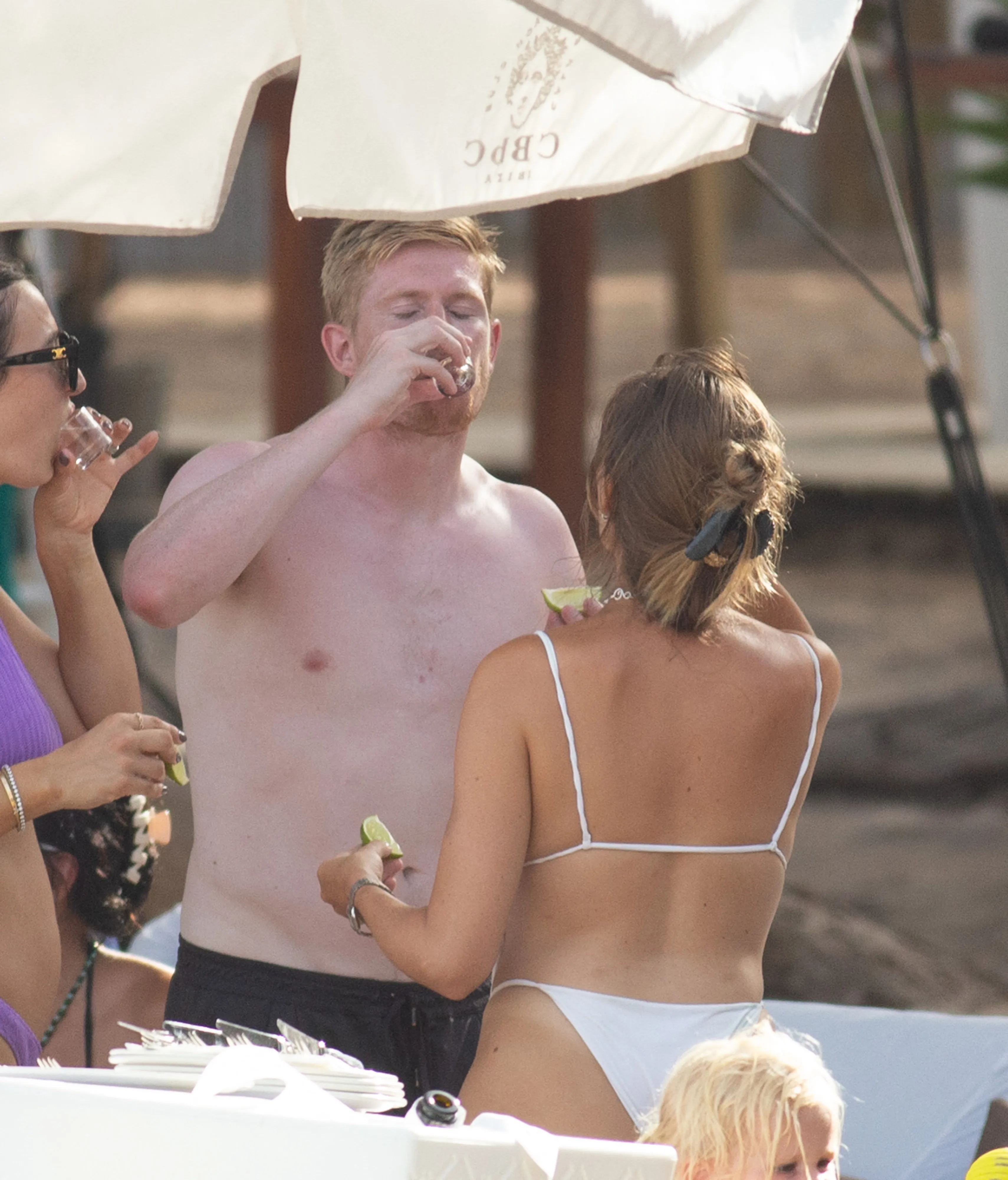 image_6707aa499e63e Kevin De Bruyne and Michele Lacroix knocked back a shot at a beach club